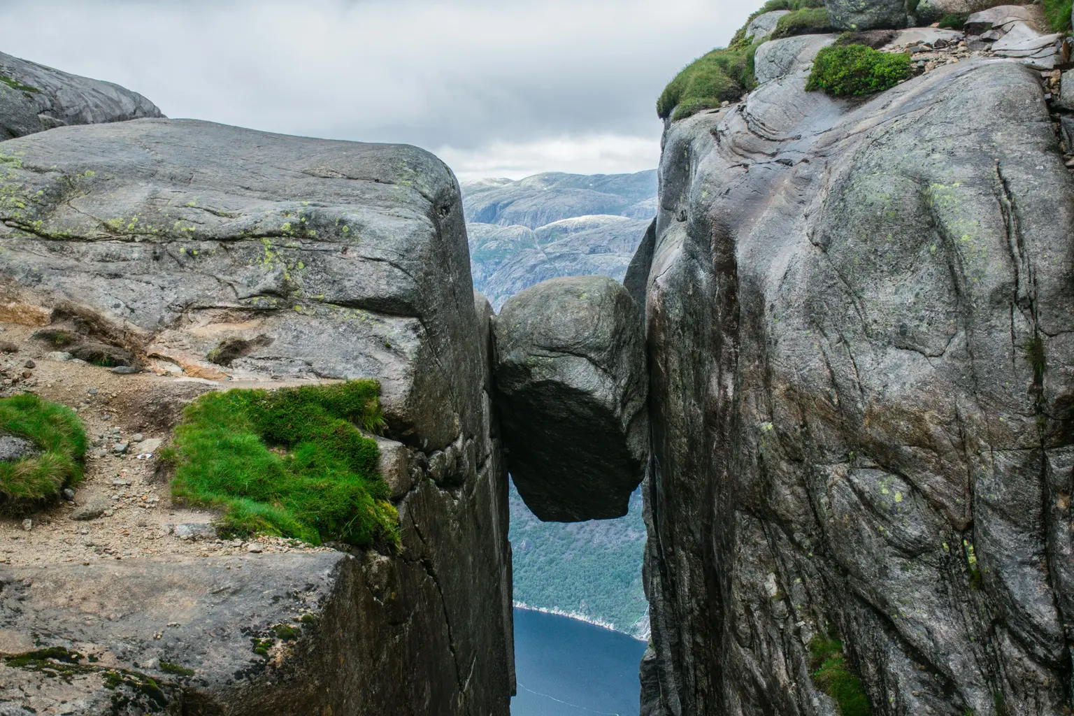 Famous Kjeragbolten rock in Norway. Polymathes Academy Norwegian language courses Famous Kjeragbolten rock in Norway. Polymathes Academy Norwegian language courses